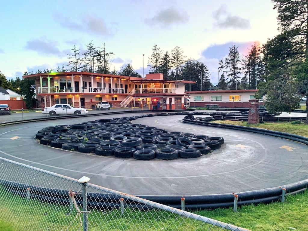 a bunch of tires sitting on a circle in front of a building at Breakers Boutique Inn in Westport