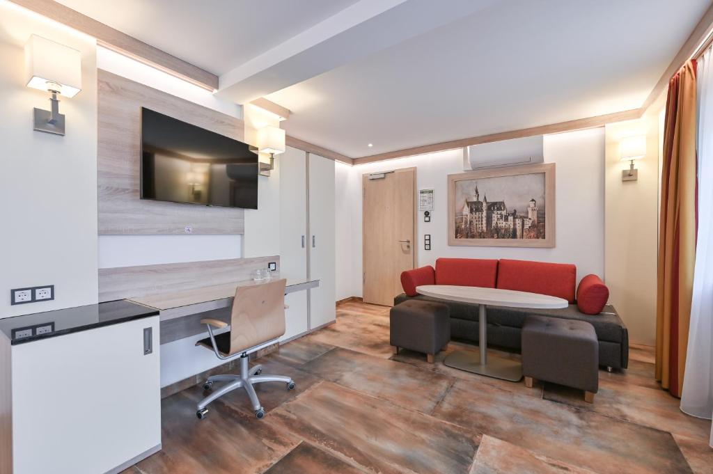 TV a/nebo společenská místnost v ubytování Hotel Ludwigs