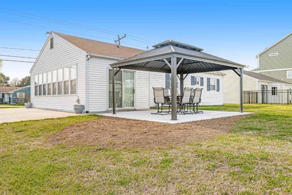 a gazebo with a table and chairs on a patio at Dockside Daydreamin' in Ocean City