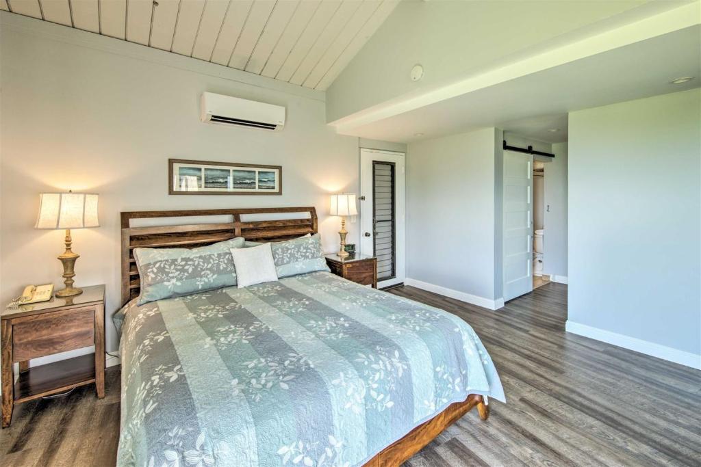 a bedroom with a large bed and a wooden floor at Hanalei Bay Resort 8234 in Princeville