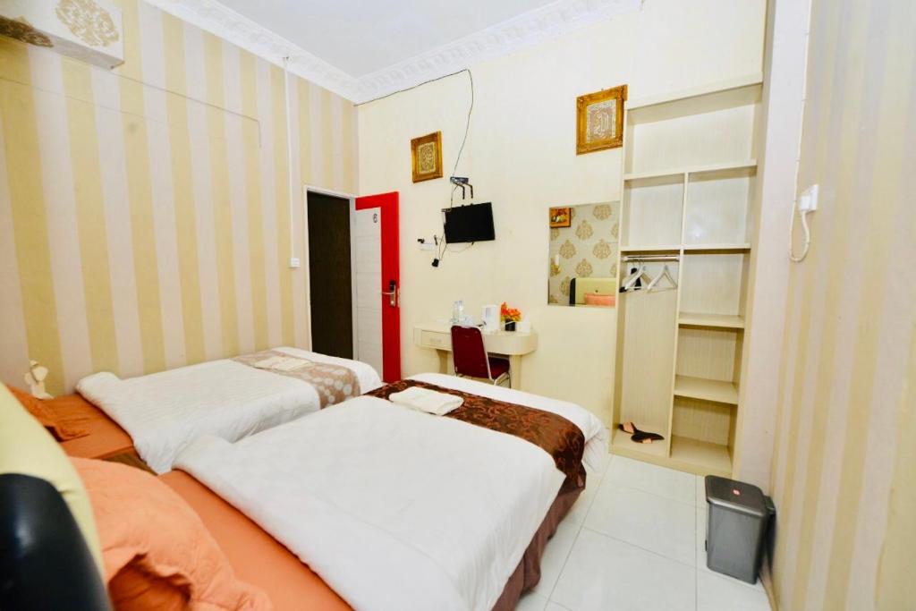 TV a/nebo společenská místnost v ubytování Hotel Alifa Syariah