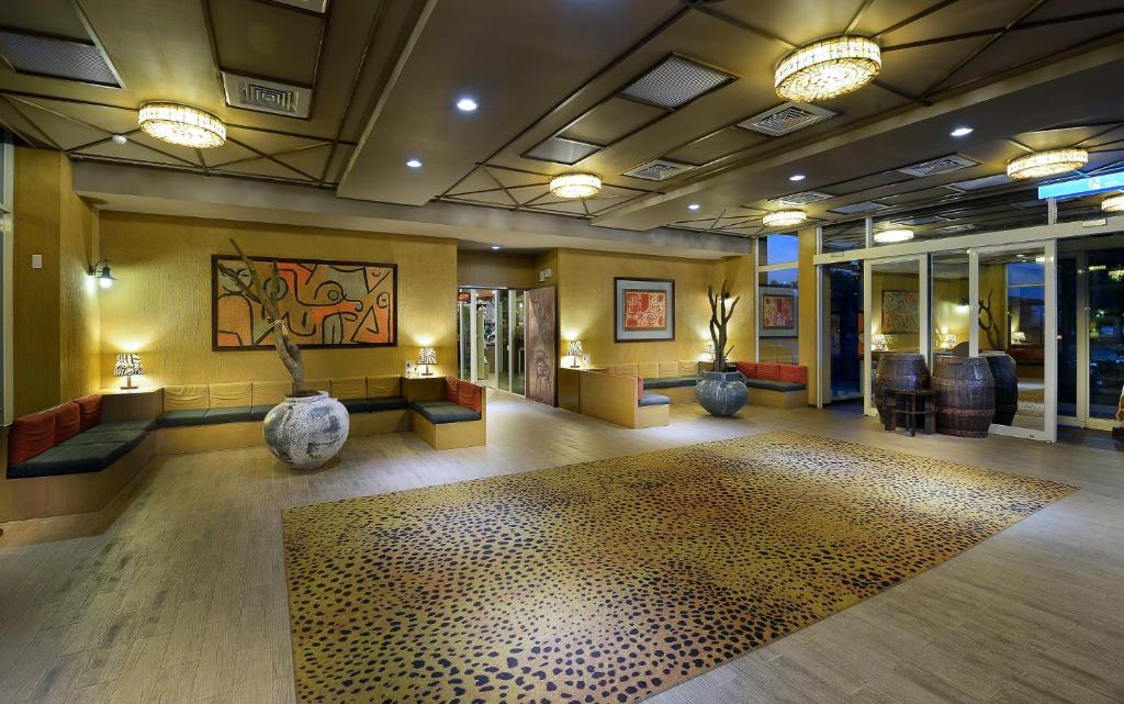 a lobby with a room with a rug on the floor at Leofoo Resort Guanshi in Guanxi