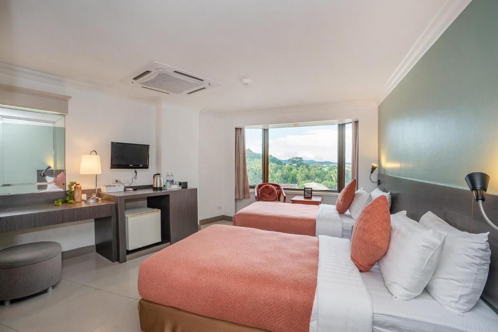 Postel nebo postele na pokoji v ubytování I Pavilion Hotel Phuket