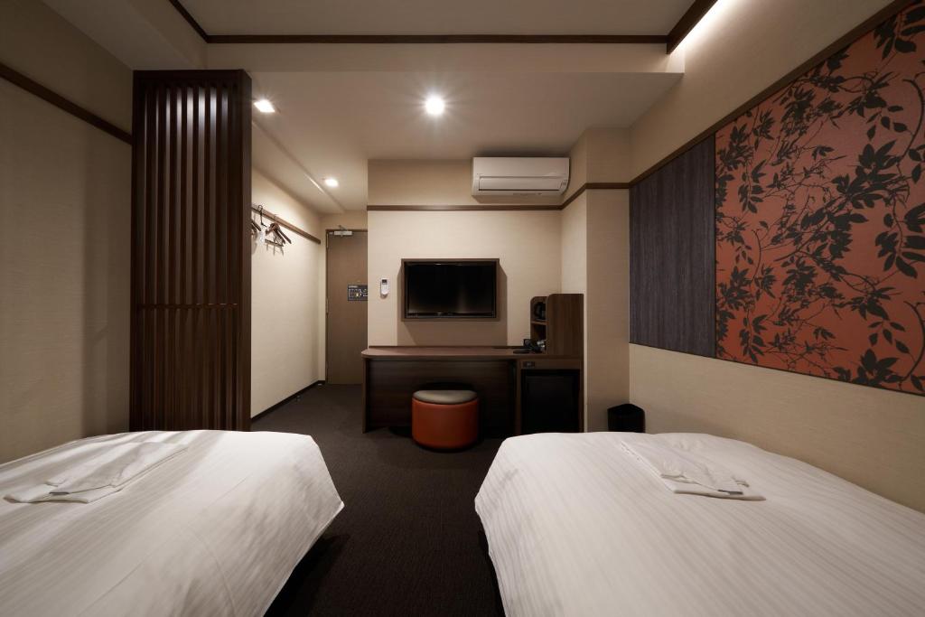 Welina Hotel Shinsaibashi NAGOMIにあるベッド