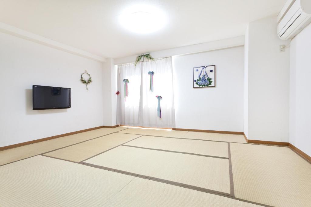 TV a/nebo společenská místnost v ubytování Hanabi Hotel