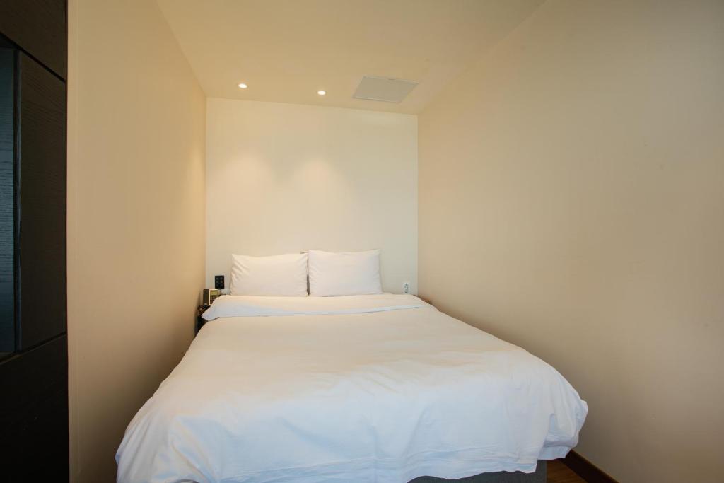 Postel nebo postele na pokoji v ubytování Winners Hotel