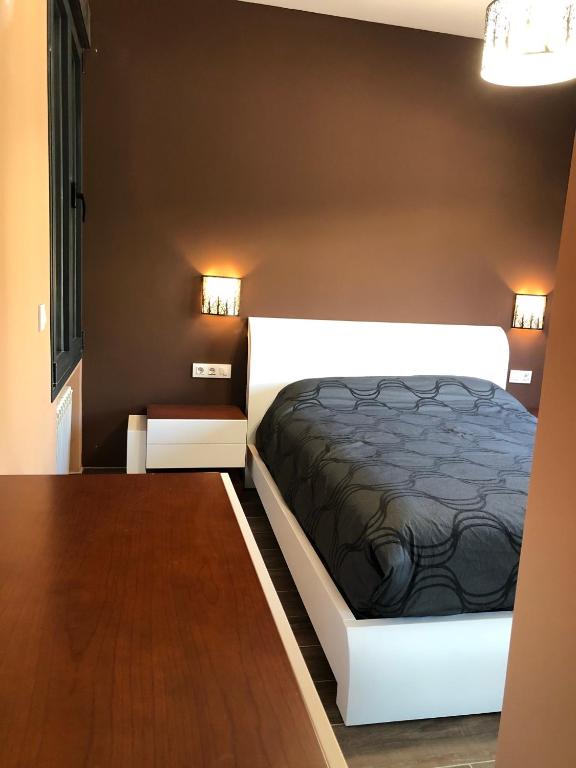 Cama o camas de una habitación en Hostal Corazón de Madrid