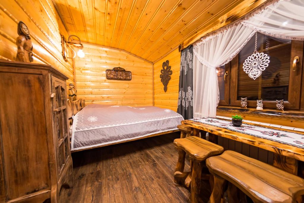 Postel nebo postele na pokoji v ubytování U Tadka dom z jacuzzi na zielonej
