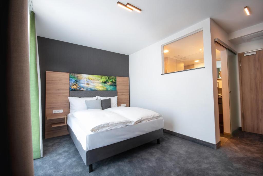 Postel nebo postele na pokoji v ubytování Hotel Kupferzell