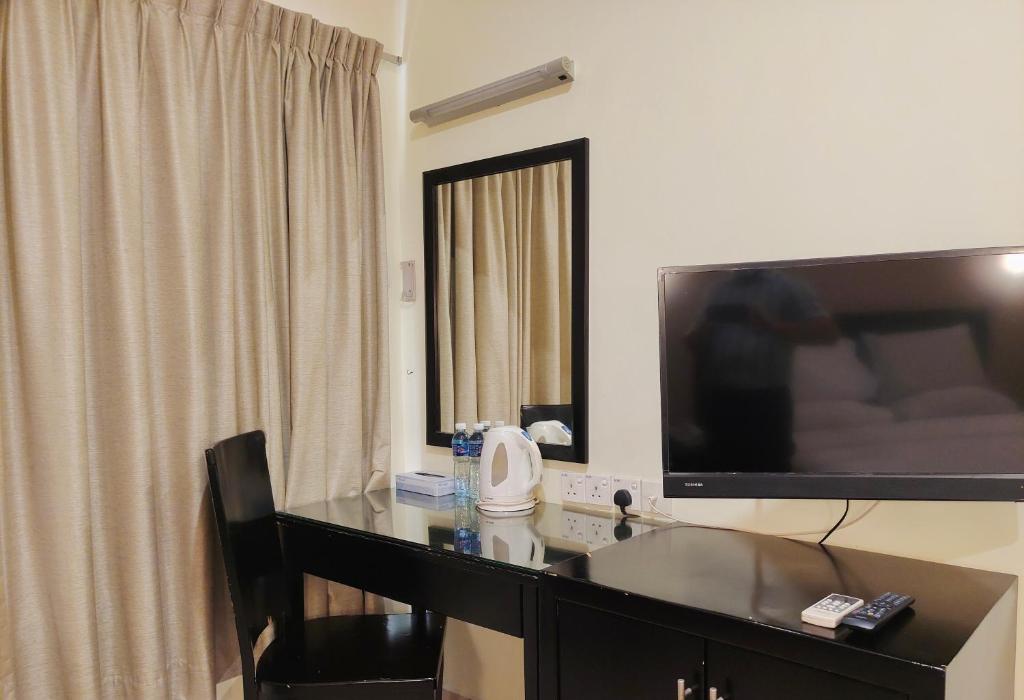 TV a/nebo společenská místnost v ubytování Megah D'aru Hotel