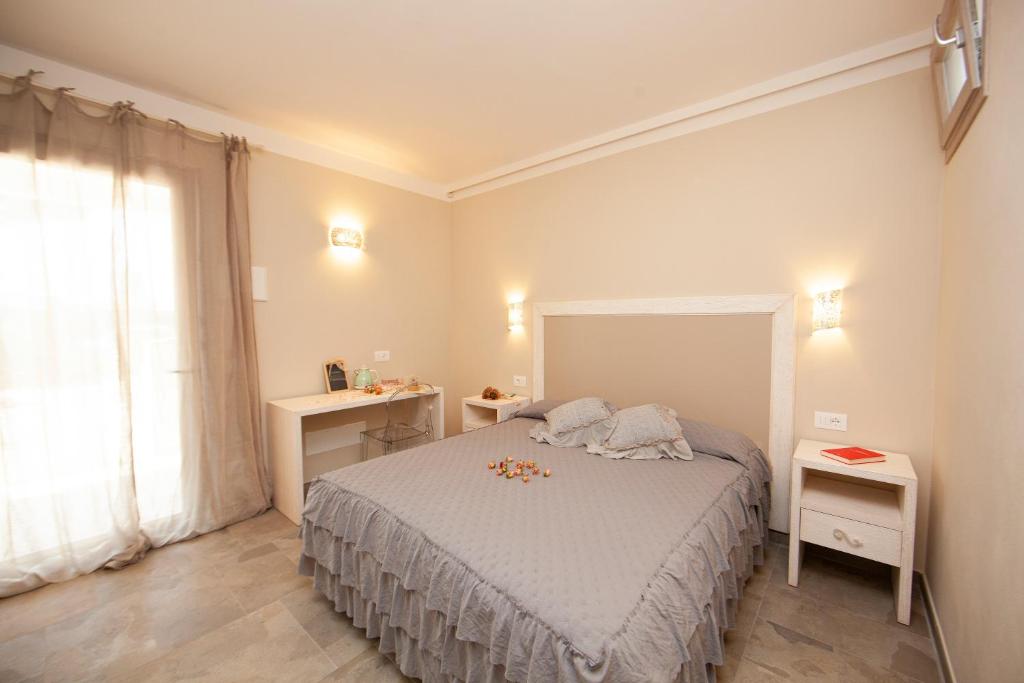 Postel nebo postele na pokoji v ubytování Podere Grandolfi B&B