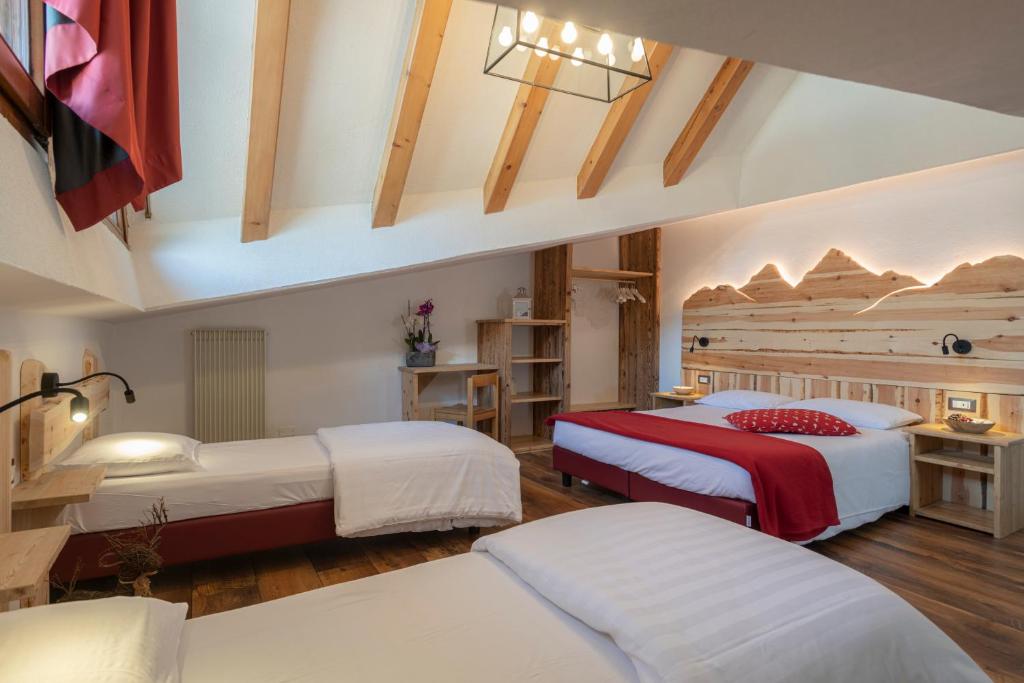 Postel nebo postele na pokoji v ubytování Hotel Cova