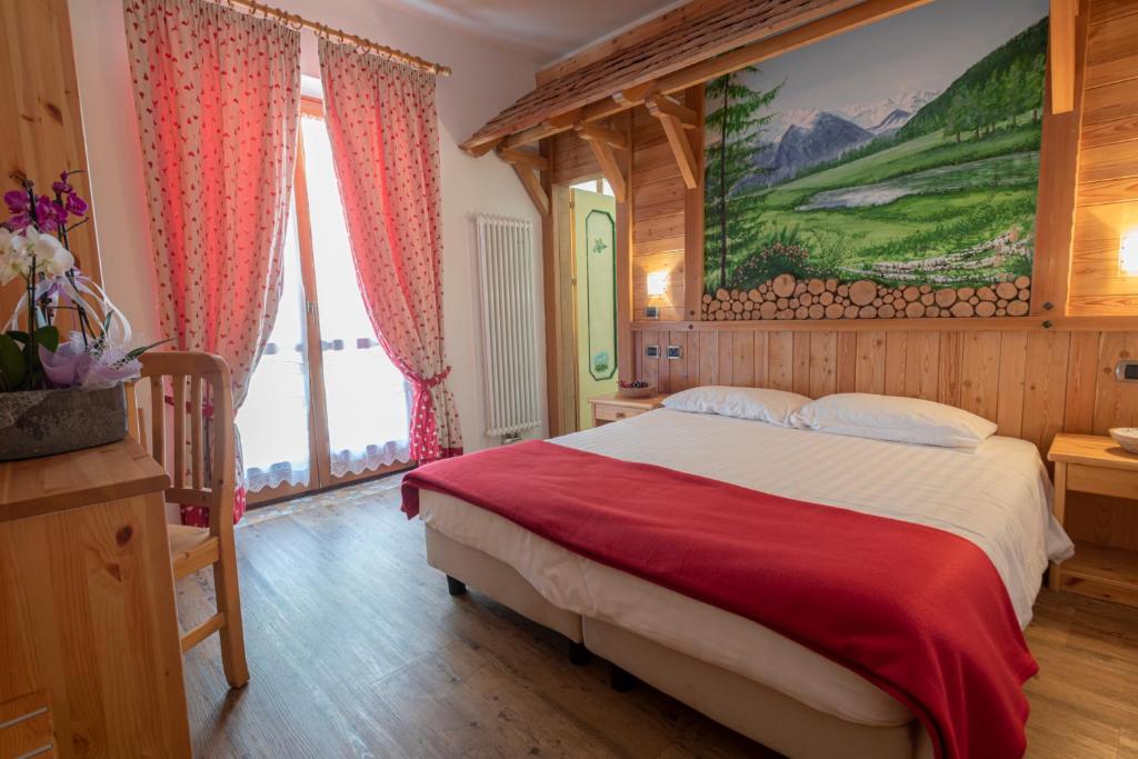 Postel nebo postele na pokoji v ubytování Hotel Cova