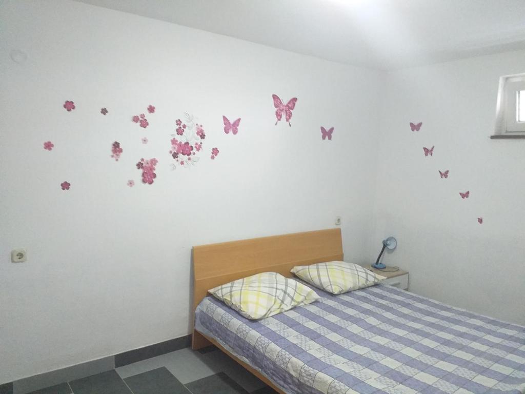Postel nebo postele na pokoji v ubytování Apartmani Branka