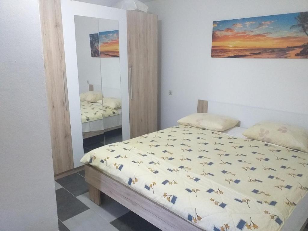 Postel nebo postele na pokoji v ubytování Apartmani Branka