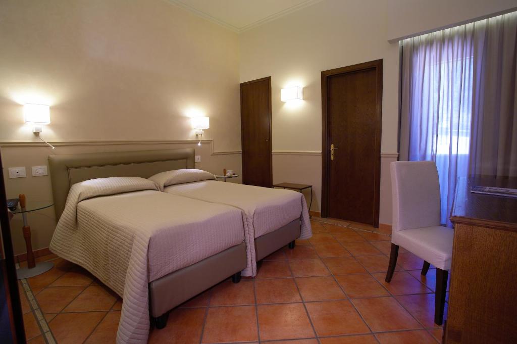 Postel nebo postele na pokoji v ubytování Airone Wellness Hotel