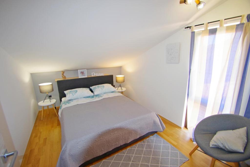 Posteľ alebo postele v izbe v ubytovaní Apartman Luci