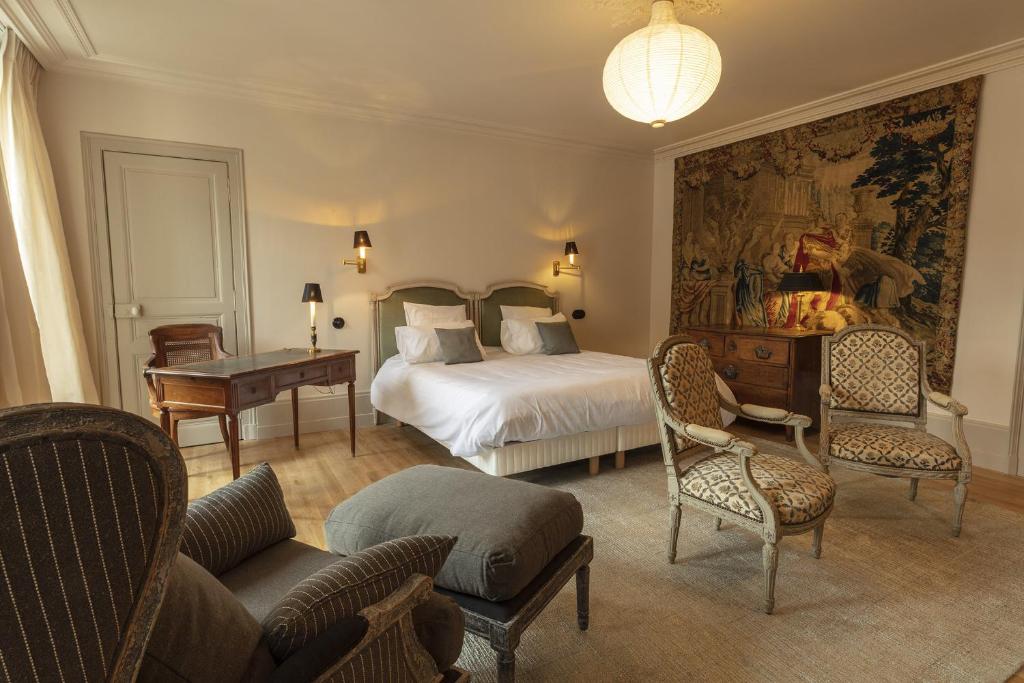 Postel nebo postele na pokoji v ubytování Hôtel de Colbert