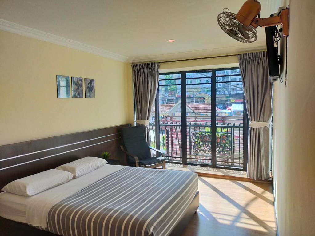 Posteľ alebo postele v izbe v ubytovaní Hong Kong Hotel