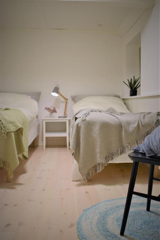 Postel nebo postele na pokoji v ubytování Tanggården Skoven