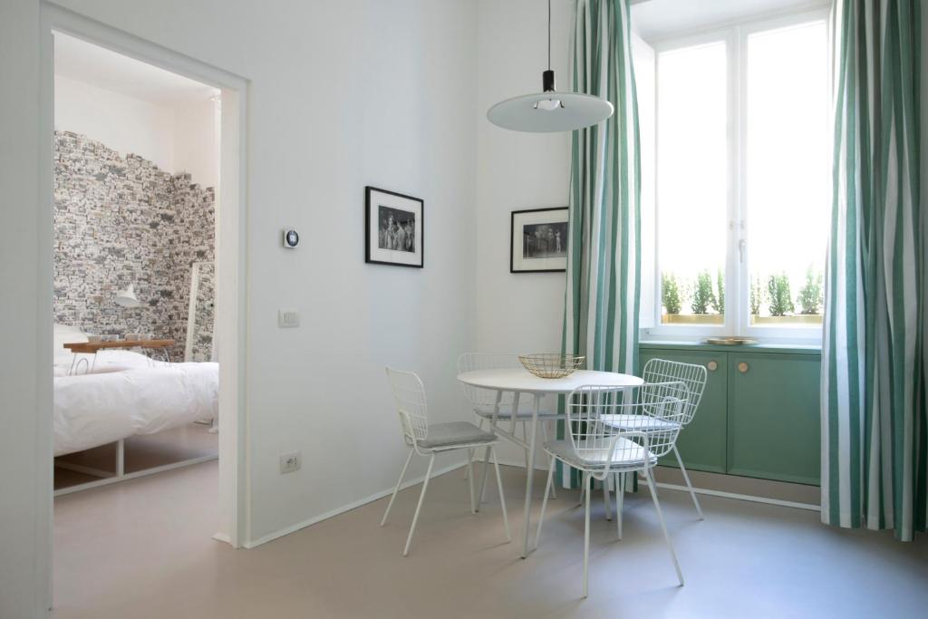 A bed or beds in a room at Piazza Fanti Luxury Apartments