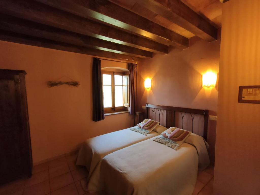 Postel nebo postele na pokoji v ubytování Casa Serra de Dalt