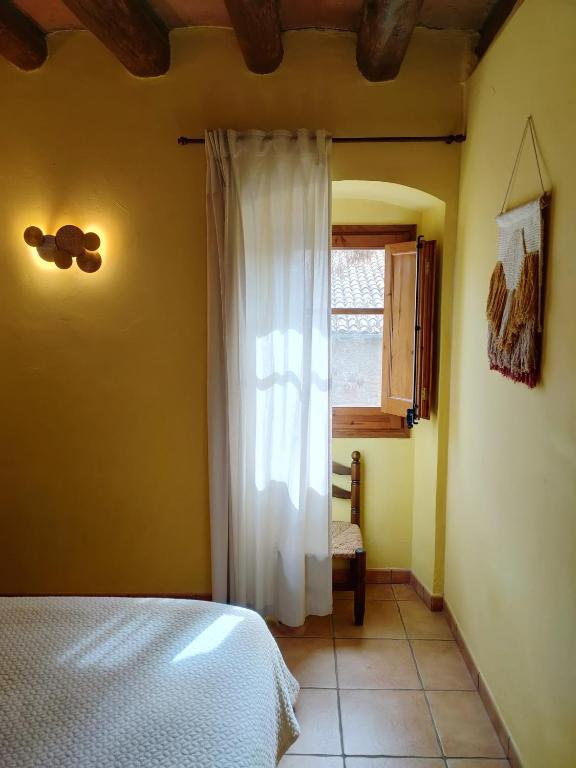 Postel nebo postele na pokoji v ubytování Casa Serra de Dalt
