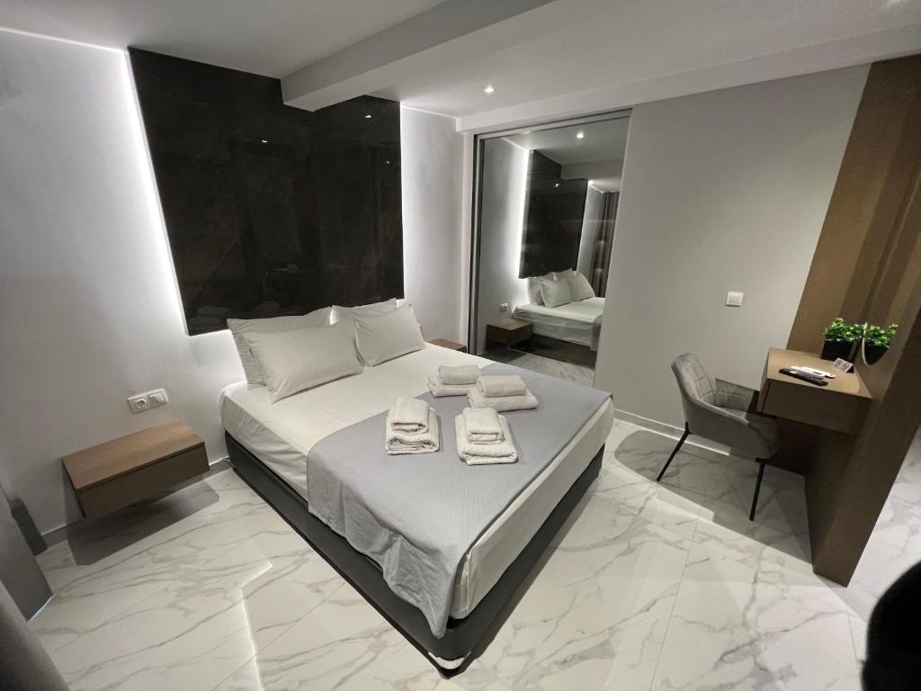 Posteľ alebo postele v izbe v ubytovaní V luxury Suites