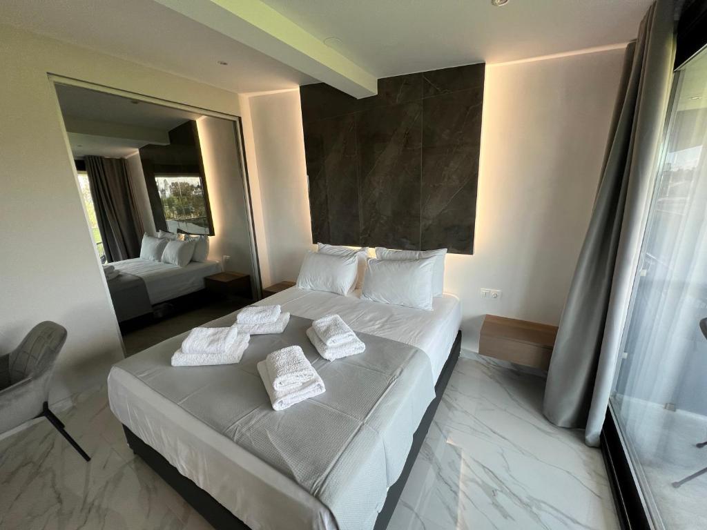 Posteľ alebo postele v izbe v ubytovaní V luxury Suites