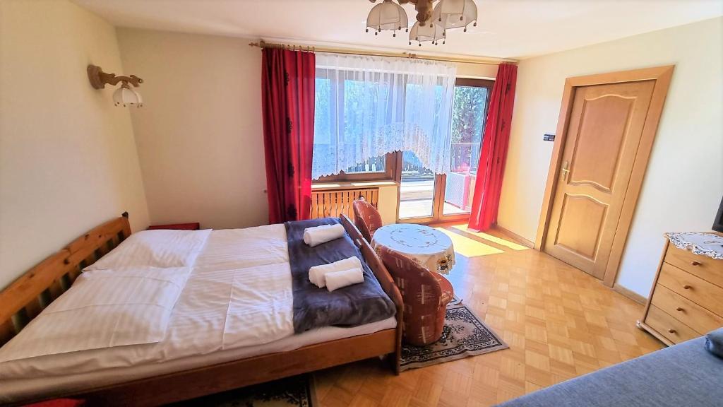 Posteľ alebo postele v izbe v ubytovaní Willa Tadeusz Zakopane