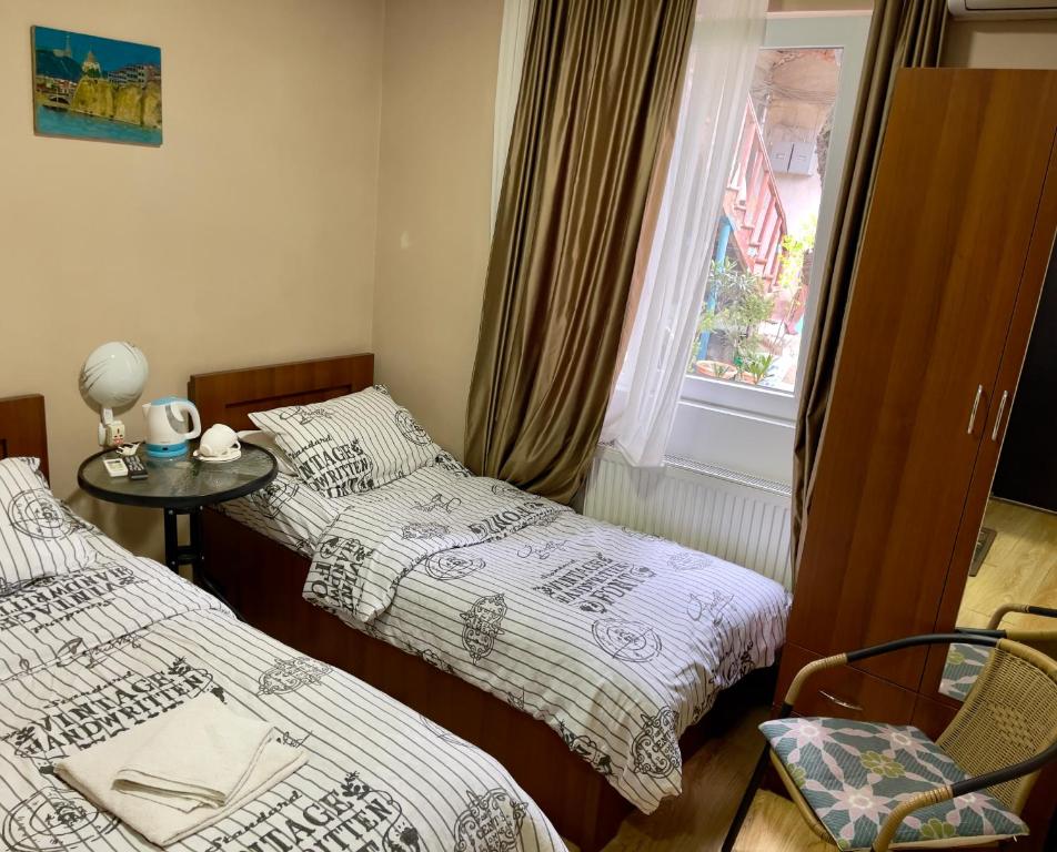 Postel nebo postele na pokoji v ubytování Hotel Maria