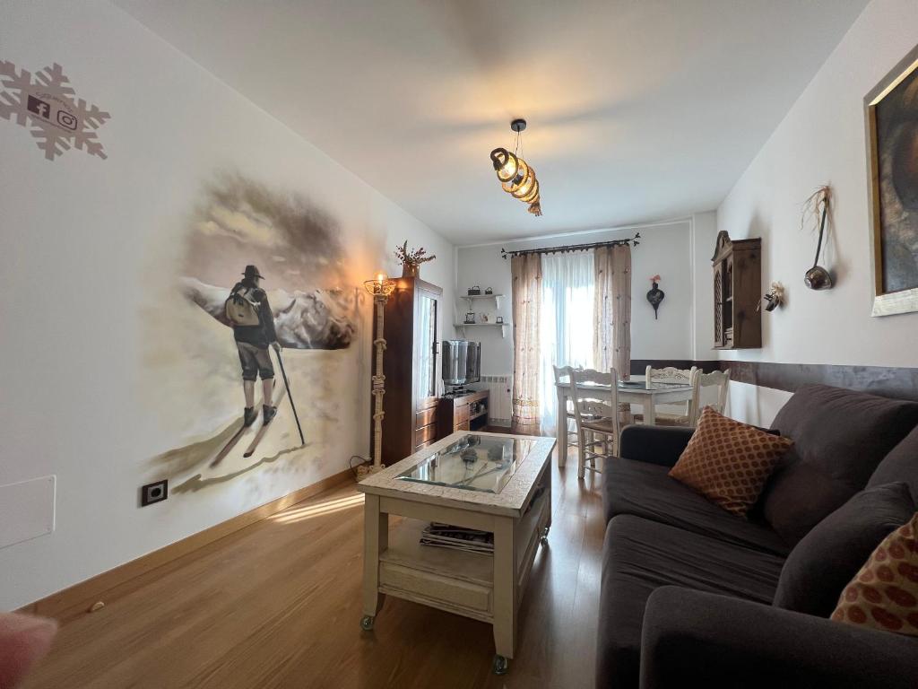 a living room with a couch and a table at A. Rural LA COVATILLA en Navacarros in Navacarros