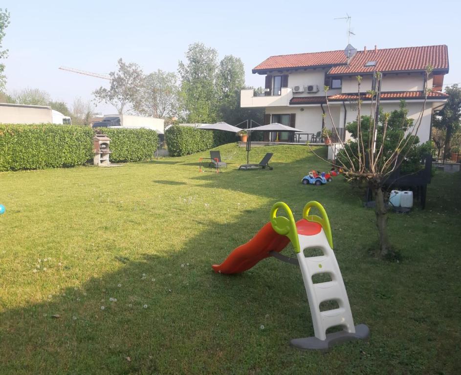 a childs play set in the yard of a house at Il giardino di Pietro in Monza