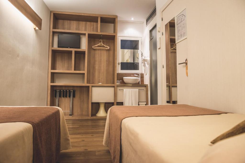 Posteľ alebo postele v izbe v ubytovaní Hostal Marenostrum