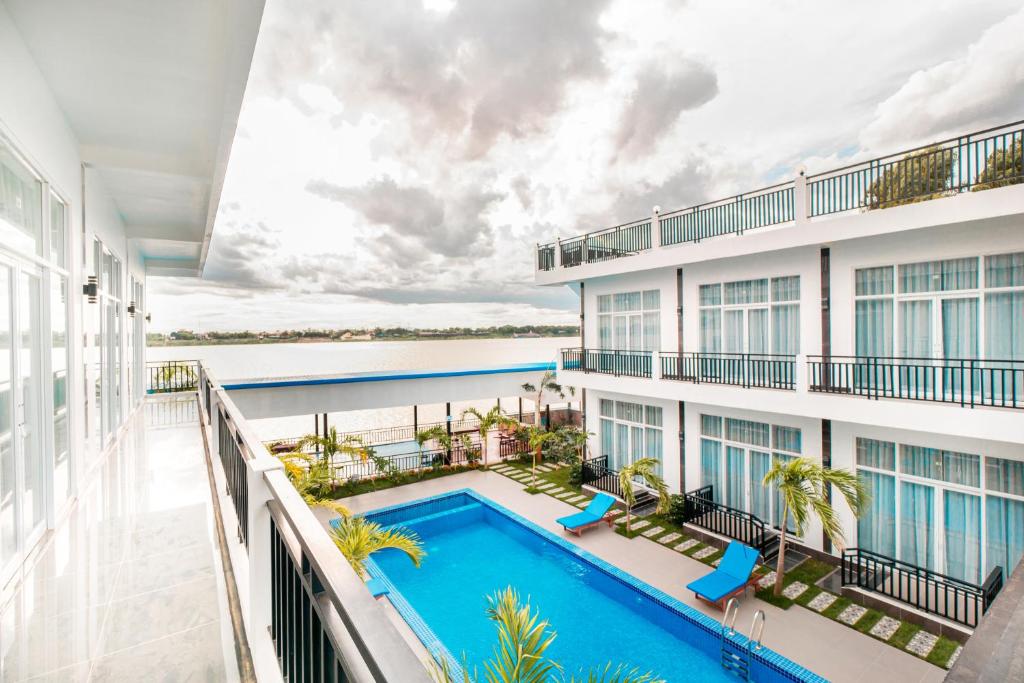 an image of the balcony of a hotel with a swimming pool at Koh Dach View Boutique Hotel in Phnom Penh