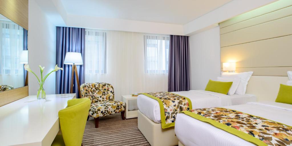 Postel nebo postele na pokoji v ubytování Hotel Festival