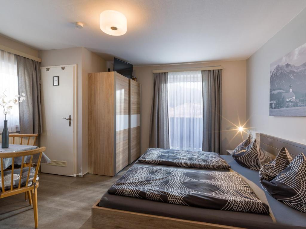Postel nebo postele na pokoji v ubytování Pension Feichter