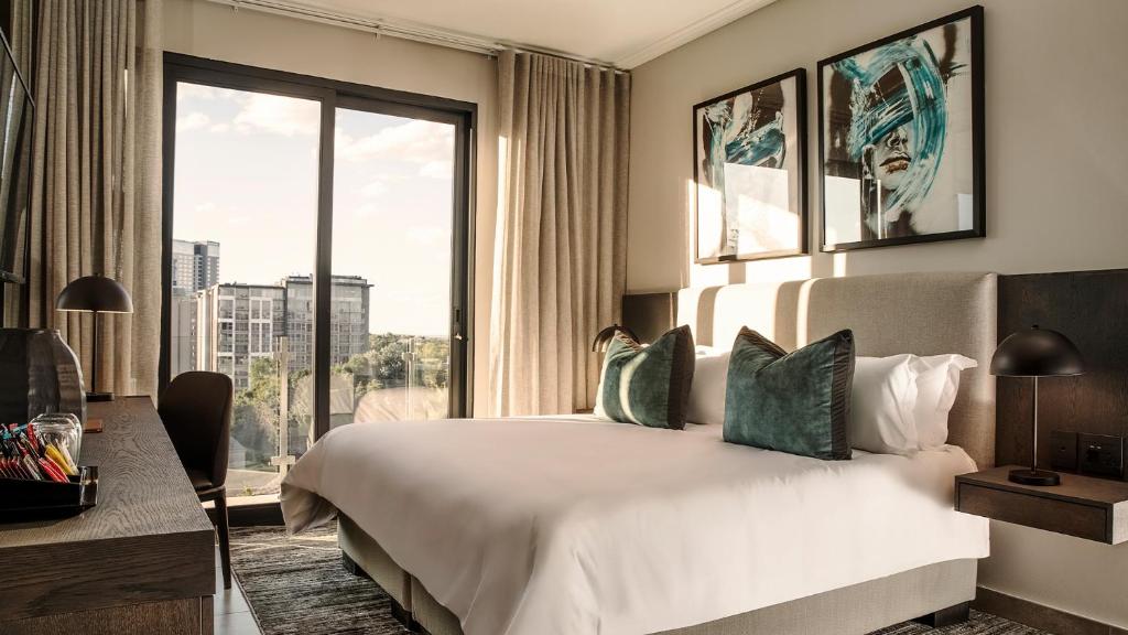 Postel nebo postele na pokoji v ubytování The Catalyst Apartment Hotel by NEWMARK