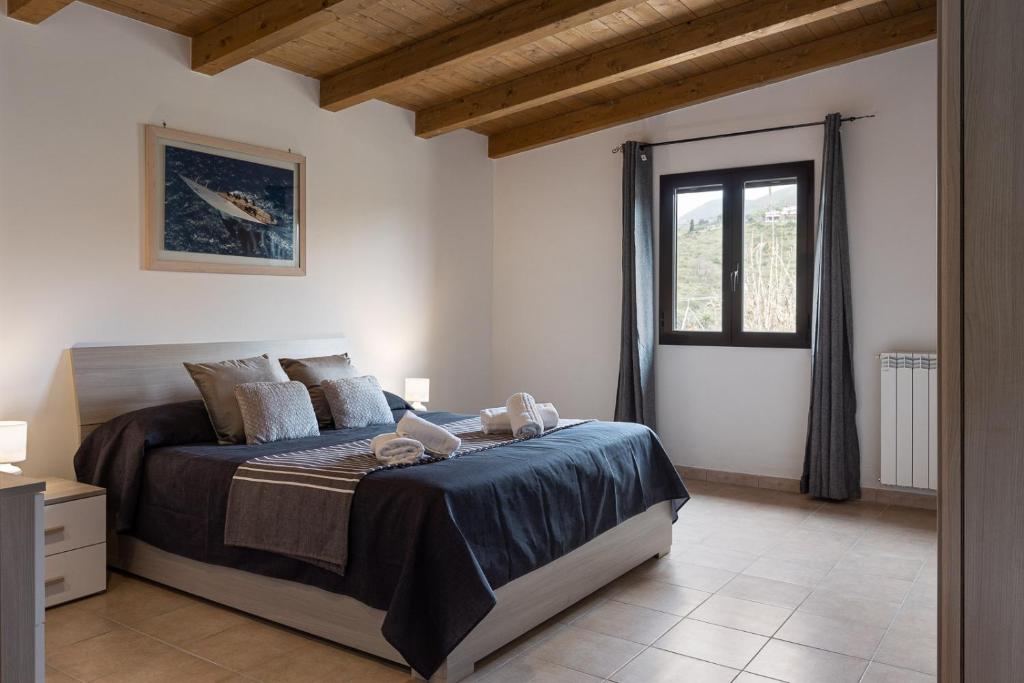 Postel nebo postele na pokoji v ubytování Villino degli ulivi