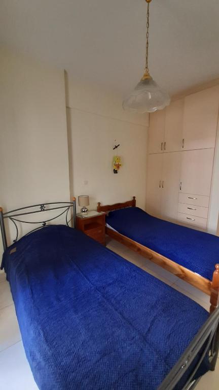 Posteľ alebo postele v izbe v ubytovaní Akrata Rose Garden Apartments I
