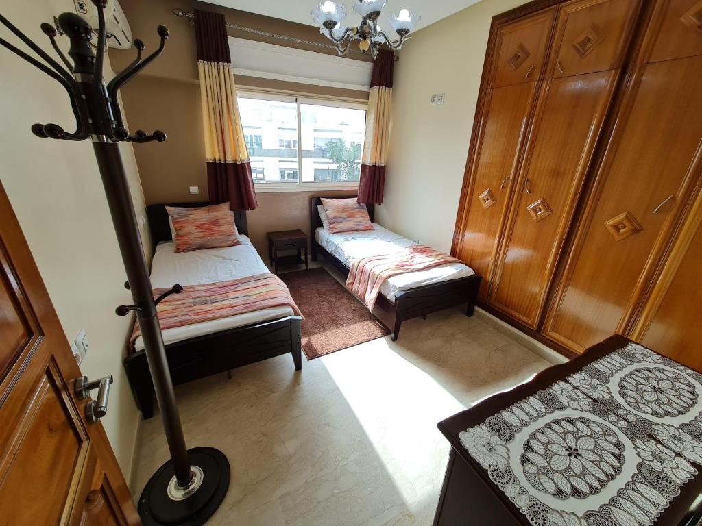 Postel nebo postele na pokoji v ubytování Figuig Appart'Hotel