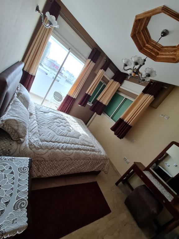 Postel nebo postele na pokoji v ubytování Figuig Appart'Hotel