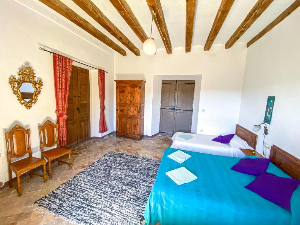 Postel nebo postele na pokoji v ubytování Casa Rural Sant Petrus de Madrona