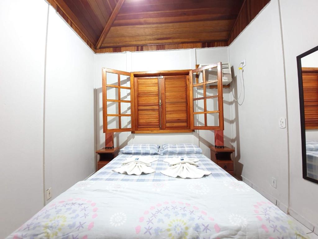 Postel nebo postele na pokoji v ubytování Pousada Canto do Curió Paraty