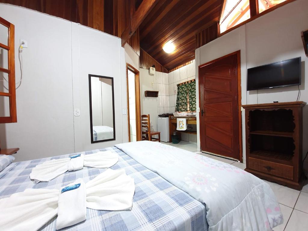 Postel nebo postele na pokoji v ubytování Pousada Canto do Curió Paraty