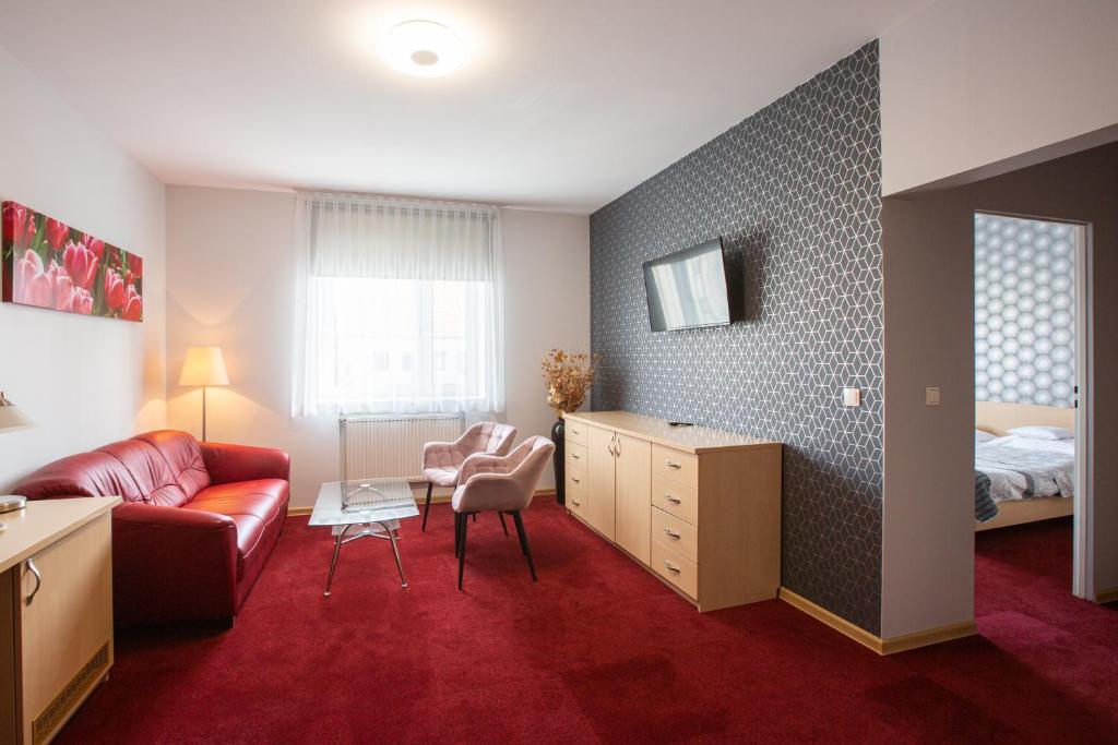 Postel nebo postele na pokoji v ubytování Hotel Łabędy