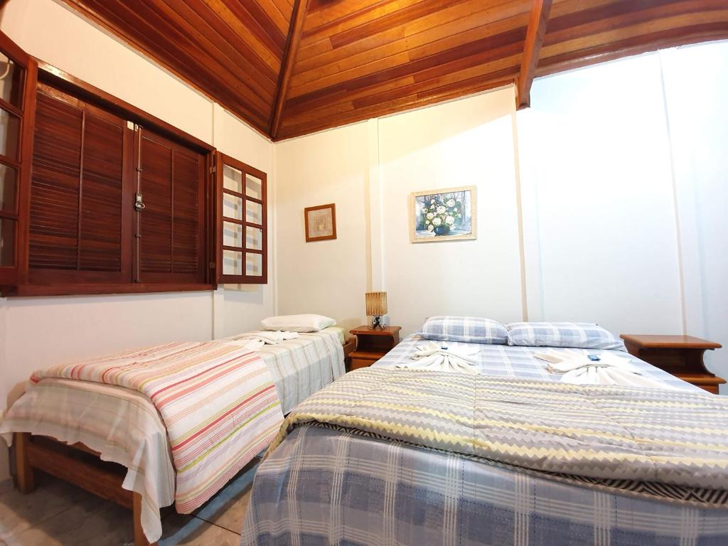 Postel nebo postele na pokoji v ubytování Pousada Canto do Curió Paraty