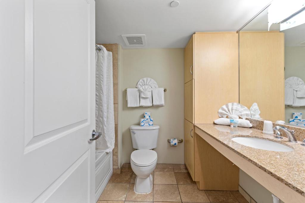 a bathroom with a toilet and a sink at Sandy Beach Resort in Myrtle Beach
