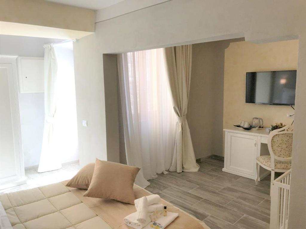 TV a/nebo společenská místnost v ubytování Hotel Volterra In Superior