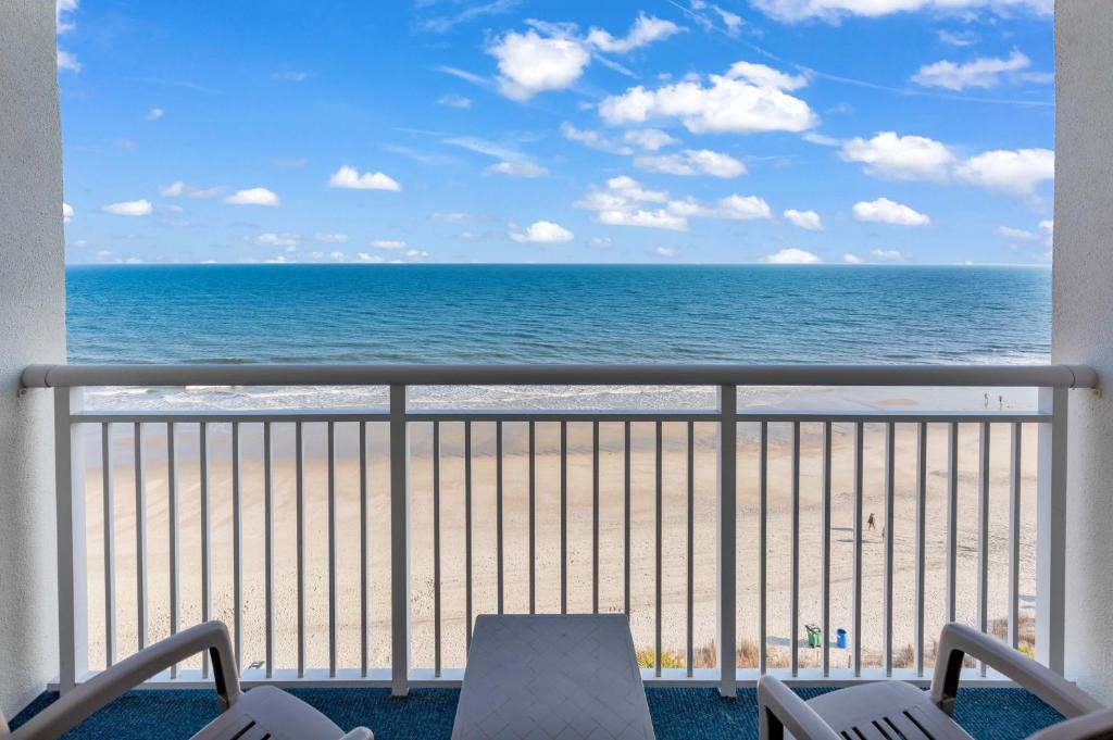 a balcony with a view of the beach at Sandy Beach Resort in Myrtle Beach